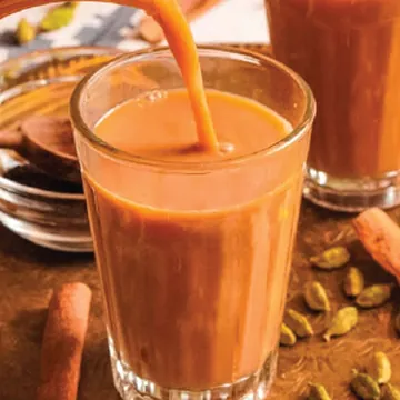 Karak chai poured into a glass